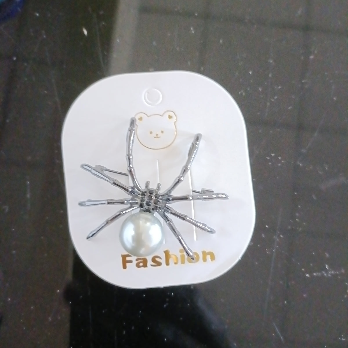 Spider brooch